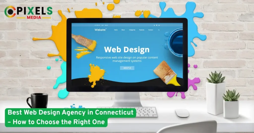 Modern computer showing web design screen with colorful paint splashes representing creative web design services in Connecticut.
