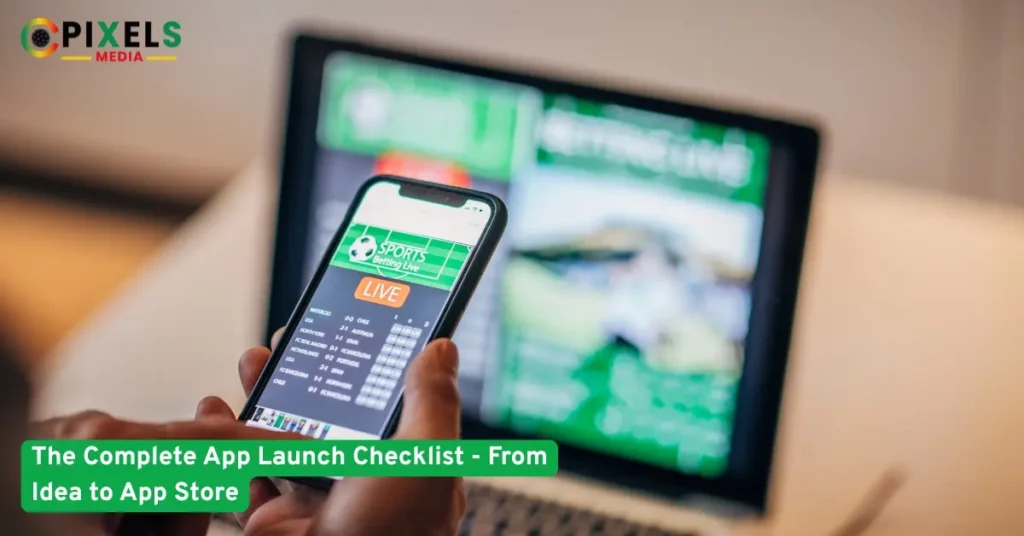 Person holding smartphone showing live sports betting app with laptop in background, illustrating app launch concept