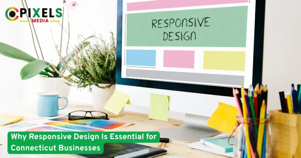 A computer screen displaying a colorful responsive web design layout,with plants,pencils,and notes on a bright designer desk